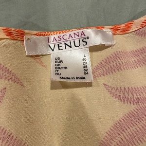 Venus, blouse. Vibrant colors of yellow, orange, and purple.